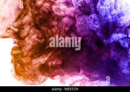 Thick colorful smoke of purple, orange on a white isolated background. Background from the smoke of vape Stock Photo