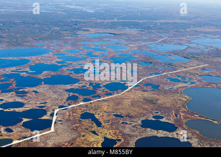 Top view of gas pipeline in endless swamps in tundra Stock Photo