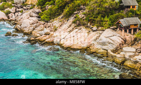 Rocky south costline of Koh Tao Islands with bungalows on granite rocks. Thailand Stock Photo