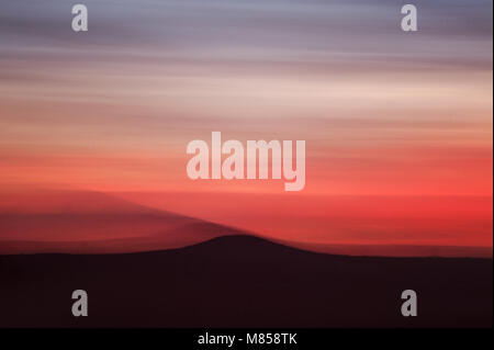Blurred horizon during a fiery red sunset at Konza Prairie in the Flint Hills, Kansas, USA Stock Photo