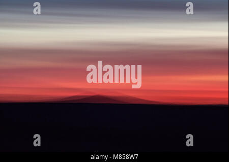 Blurred horizon during a fiery red sunset at Konza Prairie in the Flint Hills, Kansas, USA Stock Photo