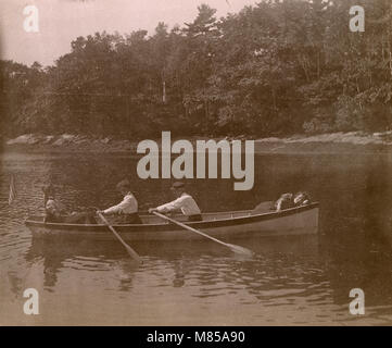 Antique circa 1905 photograph, family in a rowboat on the Sasanoa River. Location is in or near Riggsville (now Robinhood), Maine in Sagadahoc County, USA. Stock Photo