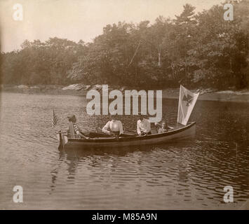 Antique circa 1905 photograph, family in a rowboat on the Sasanoa River. Location is in or near Riggsville (now Robinhood), Maine in Sagadahoc County, USA. Stock Photo