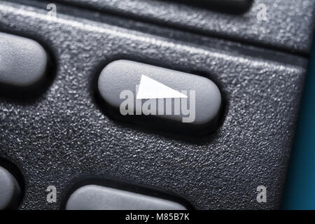 Macro Of A Black Play Button On Black Remote Control For A Hifi Stereo Audio System Stock Photo