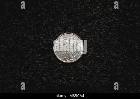 Fifty cents coin, Real currency from Brazil. Coin on a dark background. Stock Photo
