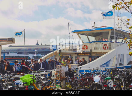 Foot passengers disembarking from ferry and bicycle park, Overhoeks, a new mixed use neighbourhood, Amsterdam, Netherlands Stock Photo