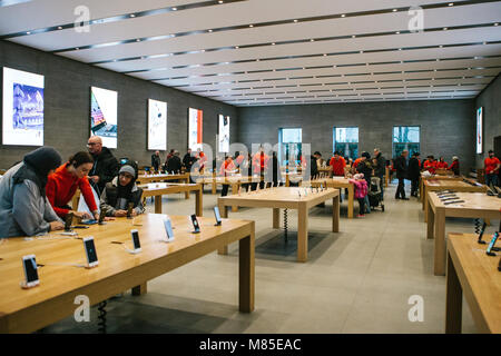 Presentation of the iPhone X and iPhone 8 plus and sales of new Apple products in the official Apple store in Berlin. Buyers are watching the new iPho Stock Photo