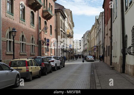 Krakow, Poland - March 11, 2018: Street of St. Anna. On the right is Collegium Maius, the oldest headquarter of the Jagiellonian University. Stock Photo