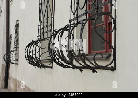 Krakow, Poland - March 11, 2018: Street of St. Anna, Forged grids in the windows of Collegium Maius, the oldest headquater of Jagiellonian University. Stock Photo