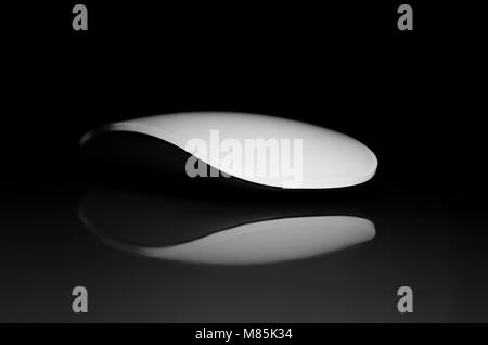 Concept with Wireless Computer Mouse and Reflection on Black Background Isolated Stock Photo