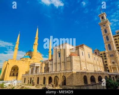 Coexistence of religions in Lebanon - Saint George Maronite Greek Orthodox Cathedral and the Mohammad Al-Amin Mosque Stock Photo