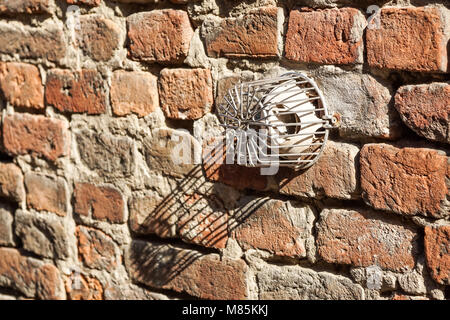 Red Brown Old Shabby Brick Wall Square Background Or Texture With Ventilation Hole. Retro Urban Brickwall Frame Wallpaper. Grungy Textured Clay Brick Wall. Distressed Brickwall Surface. Stock Photo