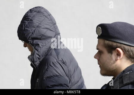 Prague, Czech Republic. 15th Mar, 2018. The police and state attorneys proposed that Prague High Court judge Ivan Elischer, arrested on suspicion of corruption, and another five accused in his case be remanded in custody, on which a court will decide later today, Prague district court deputy head Michal Dvorak has told CTK. On the photo police officer brings Elischer (left) to Prague district court in Prague, Czech Republic, on March 15, 2018. Credit: Katerina Sulova/CTK Photo/Alamy Live News Stock Photo