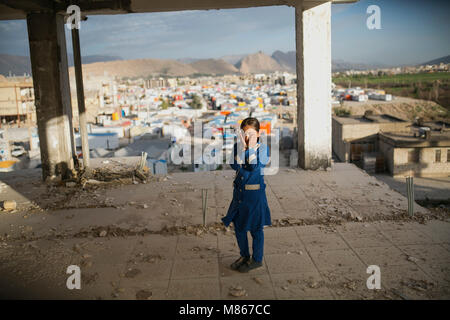 (180315) -- SARPOL-E ZAHAB, March 15, 2018 (Xinhua) -- Paria cries as she looks at her damaged family house in Sarpol-e Zahab city, western Iran, on March 11, 2018. Paria, 10-year-old Iranian-Kurdish girl, lost her father during a 7.3-magnitude earthquake on Nov. 12, 2017. Now, she is living with her mother and only brother in a conex home, as their house was completely destroyed during the tremor. She has had her father as the 'hero' of her life, she sobbed. Asked what her top dream in her life is, she dropped her head saying in low voice: 'I cannot think of another disaster like 'this' for a Stock Photo