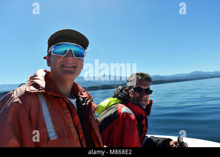 Father and son Whale watching off the coast of Vancouver Island, British Columbia, Canada. MODEL RELEASED Stock Photo