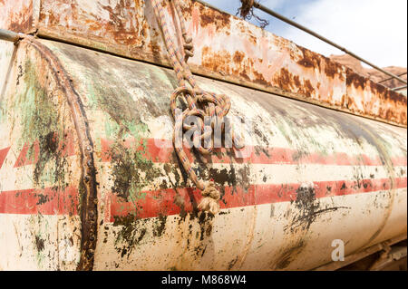 Rusty water tank for monthly supply of water in Wadi Rum village, Jordan. Stock Photo