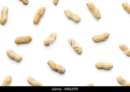 The unpeeled peanuts isolated on white background. Stock Photo
