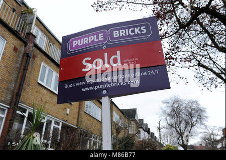 A Purple Bricks sold estate agent sign outside a house in Muswell Hill, London Stock Photo