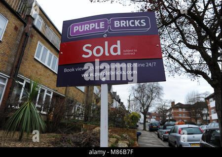 A Purple Bricks sold estate agent sign outside a house in Muswell Hill, London