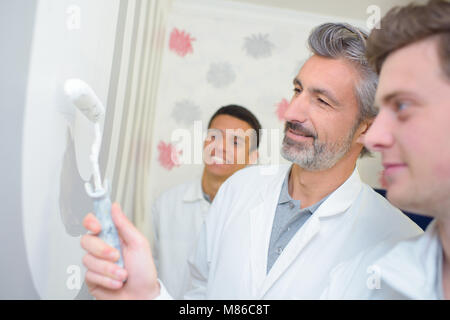 painter with apprentices Stock Photo