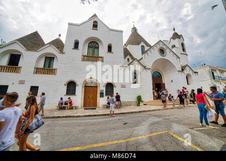 ALBEROBELLO (BA), ITALY - SEPTEMBER 1, 2016: Alberobello, with more than one hundred thousands of arrivals in 2015, drives tourism in Puglia as ninth  Stock Photo