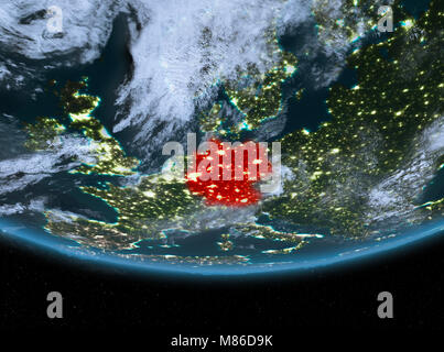 Germany at night highlighted in red on planet Earth with clouds. 3D illustration. Elements of this image furnished by NASA. Stock Photo