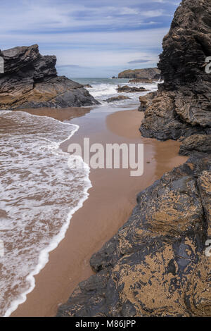 Rocks and cliffs at Llangrannog beach at low tide, Wales coast Stock Photo