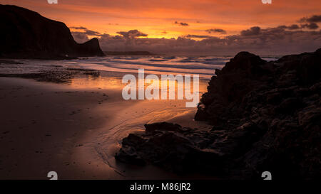 Llangrannog beach at sunset at low tide, Wales coast Stock Photo