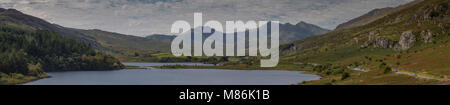 Panorama of Llyn Mymbyr and Snowdon on a sunny day in Snowdonia, North Wales Stock Photo