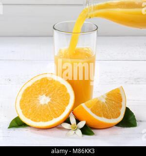 Orange juice pouring pour bottle square oranges fruit fruits drink Stock Photo
