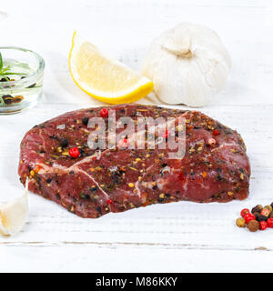 Meat raw beef steak square wooden board wood Stock Photo