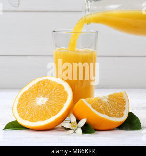 Orange juice pouring pour square oranges fruit fruits drink Stock Photo