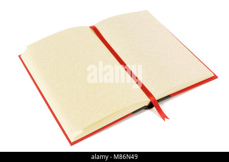 Old blank book with yellow parchment pages and ribbon bookmark isolated on a white background.  Space for copy. Stock Photo