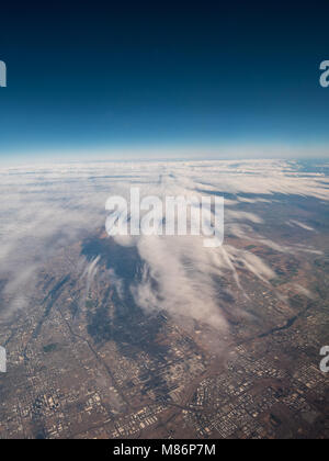 Carpet of Clouds Over Large America City during the Day Trip Stock Photo