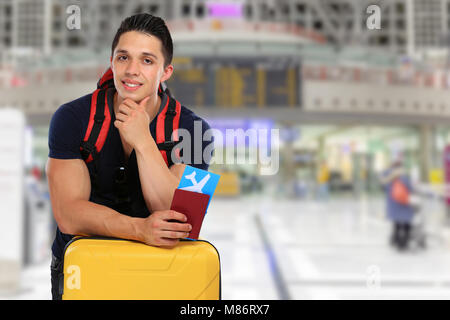 Young man flight ticket flying airport travel traveling luggage vacation holidays baggage Stock Photo