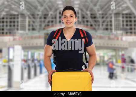 Young man with luggage baggage airport bag flying travel traveling vacation holidays fly Stock Photo