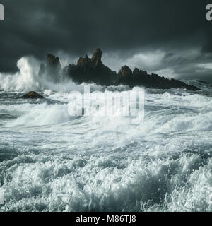 Waves crashing along rocky coastline, County Antrim, Northern Ireland, United Kingdom Stock Photo