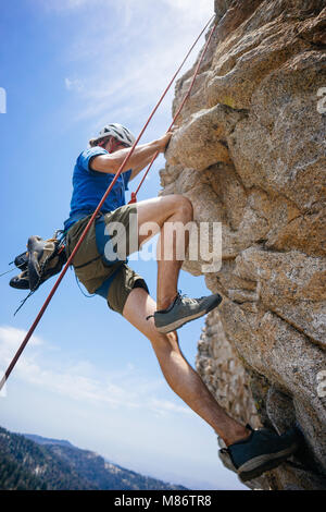 Man rock climbing, Buck Rock Lookout, Sequoia National Forest, California, United States Stock Photo