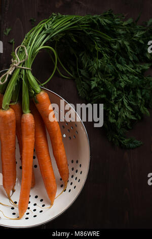 Carrots in a colander Stock Photo