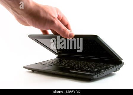 Laptop half closed on white background isolated Stock Photo