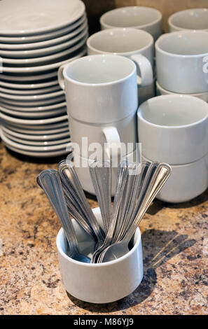 Cups, saucers and spoons. Catering supplies Stock Photo