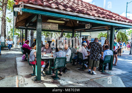 Elderly Cuban American people at the Domino Park, Calle Ocho, Miami, Florida, USA. Stock Photo