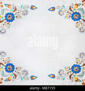 Folk frame made of handmade embroidery elements. Stock Photo