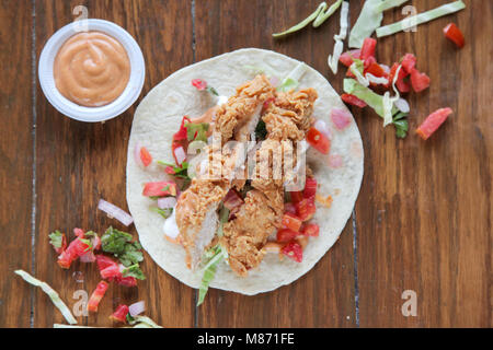 Fried chicken tortilla wrap taco Stock Photo