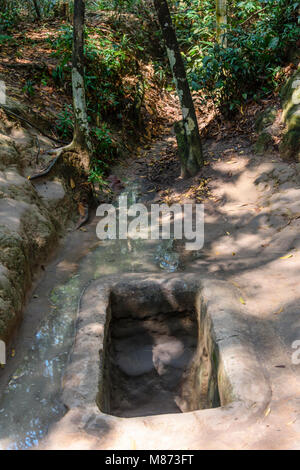 Entrance hole to the Chi Chu tunnels, Vietnam Stock Photo