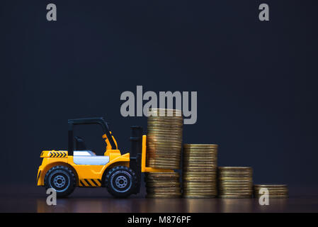 Loading Coin Mini forklift truck loading stack coin with steps of gold coin ...