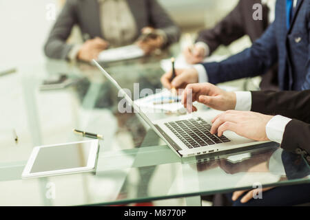 business team using a laptop is doing a marketing report on workplace Stock Photo