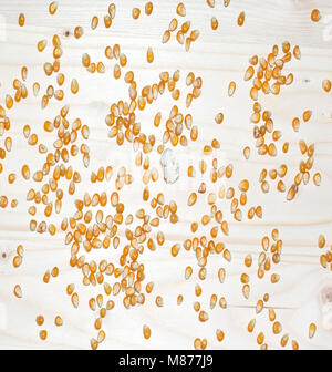Corn seeds, popcorn on wood background Stock Photo