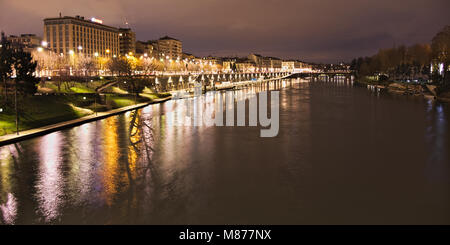 Po river flowing along Torino city near Murazzi docks at night, Italy Stock Photo