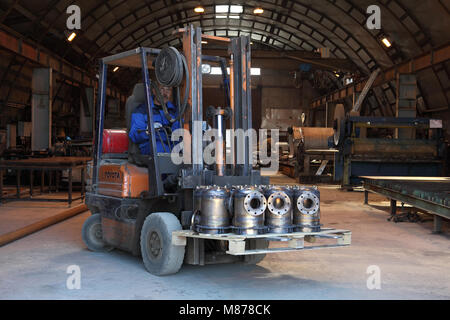 St. Petersburg, Russia - May 30, 2017: Forklift truck transports metal products through the factory. Stock Photo